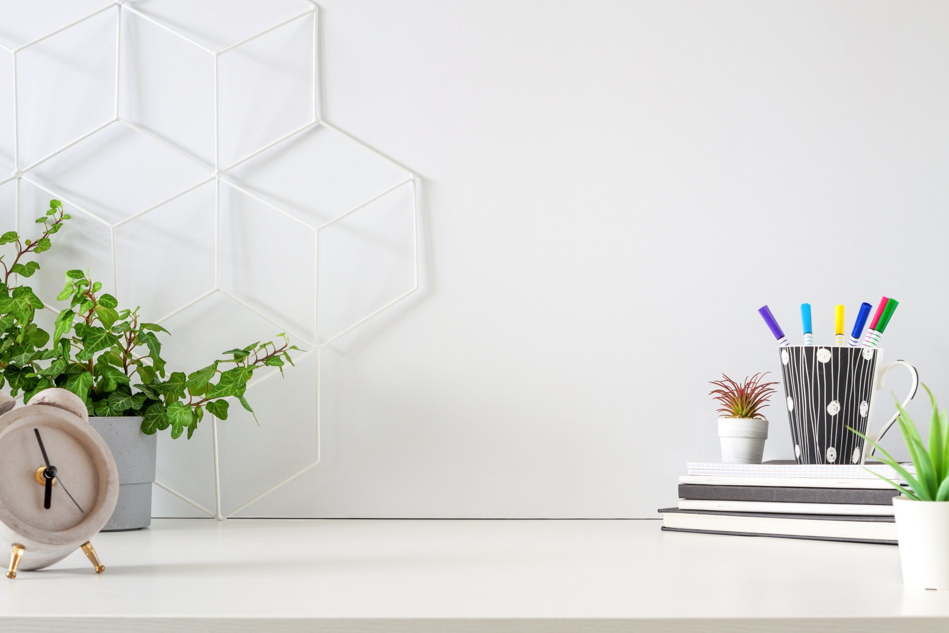 An office by an empty wall. Home Office. School desk.